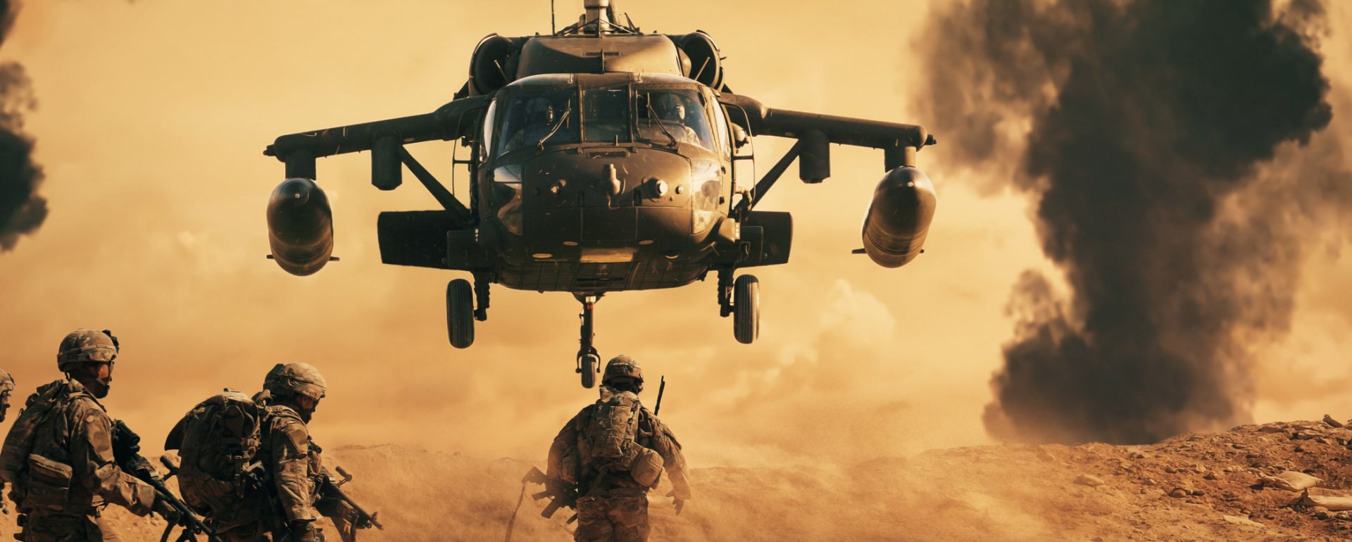 military operation involving military drones, a helicopter, and several soldiers on a battlefield